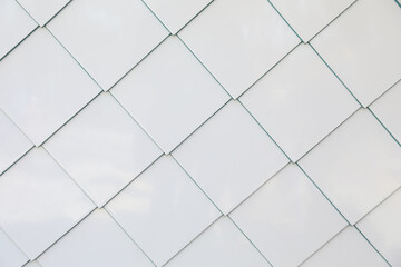 Texture of white tiled wall as background