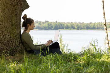 Work from anywhere. Remote freelancer work in nature using renewable energy via a foldable solar...