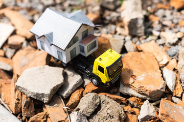 toy trucks with a house on a natural background