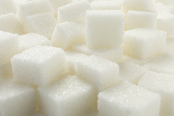 White sugar cubes as background, closeup view