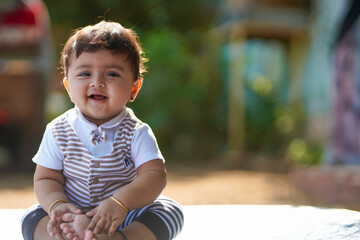 Indian baby girl smiling and giving expression.