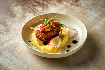 Catfish steak in sweet and sour sauce with mashed potatoes. Selective focus, close-up