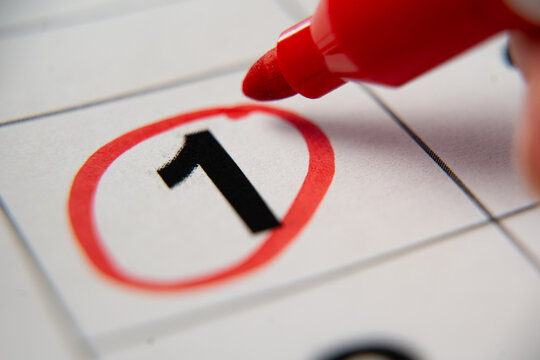 The calendar 1st day of the month is circled. A red marker circles the first day of the paper calendar. A very important date in the calendar