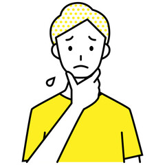 手で顎を触り、困った様子の若い男性