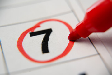 The calendar 7st day of the month is circled. A red marker circles the first day of the paper...