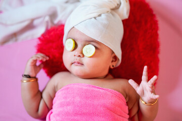 Cute indian little girl child doing make up