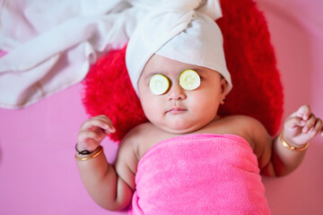 Cute indian little girl child doing make up