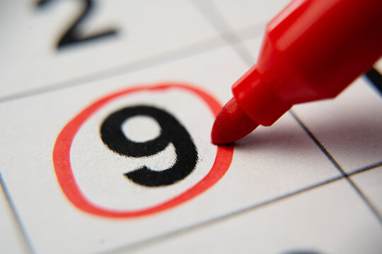 The calendar 9th day of the month is circled. A red marker circles the ninth day of the month from the paper calendar. A very important date in the calendar