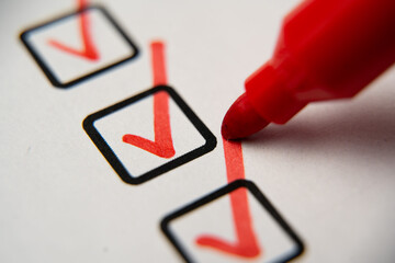 Check the box in the checklist with a red marker. Completed and completed task, obligation,...