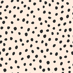 Cute black hand drawn polka dot on beige background. Vector seamless jumble brush spots pattern. Random dots, circles, animal skin. Design for fabric, wallpaper, textile, wrapping paper, packaging. - obrazy, fototapety, plakaty