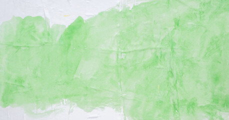 Abstract green watercolor on crumpled and creased paper texture background