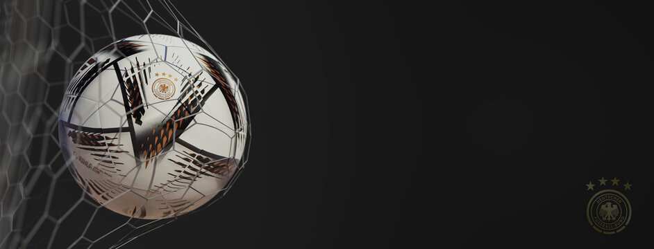 Guilherand-Granges, France - July 22, 2022. FIFA World cup Qatar 2022. Soccer ball in net with official logo of Deutscher Fussball Bund. 3D rendering.