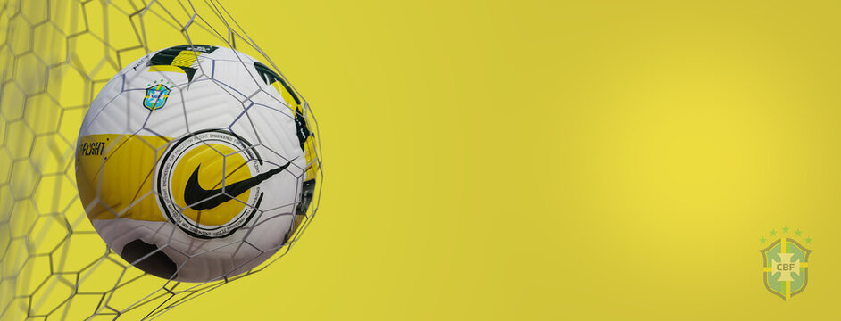 Guilherand-Granges, France - July 22, 2022. National football team of Brezil. Soccer ball in net with official logo of Brazilian Football Confederation. 3D rendering.