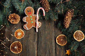 Gingerbread men laying on wood background. Christmas or New Year composition. copy space. Christmas or New Year composition. Christmas card.