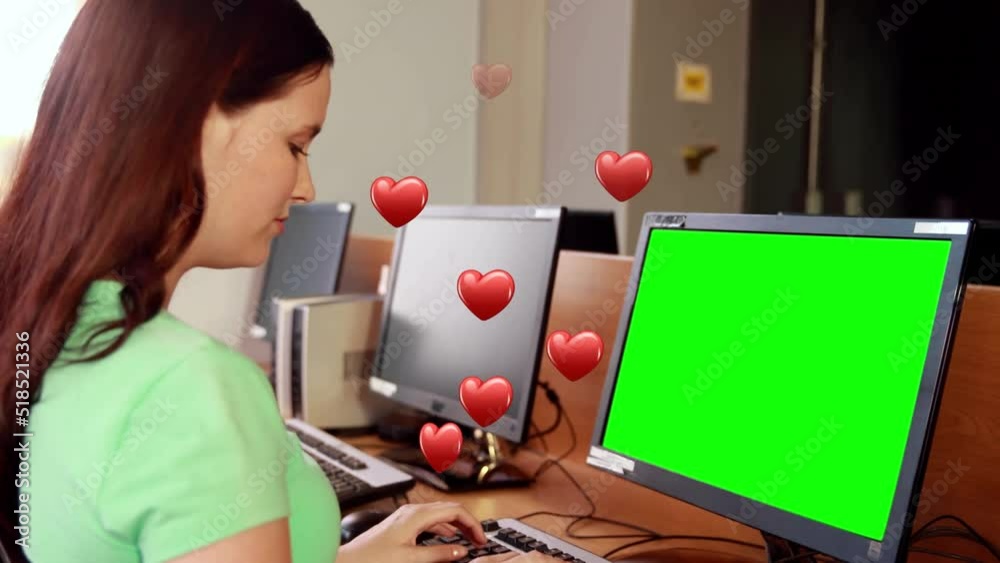 Canvas Prints Animation of hearts falling over woman using computer with copy space