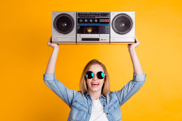 Photo of girl hold raise boom box wear yellow youth style clothes isolated over colorful background