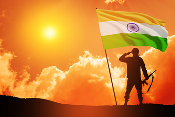 Silhouette of soldier with India flag on a background the sunset or the sunrise. Greeting card for Independence day, Republic Day. India celebration.