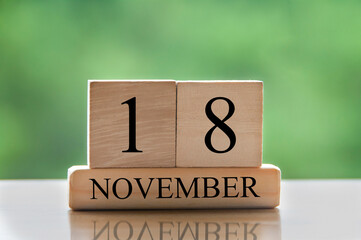 November 18 calendar date text on wooden blocks with copy space for ideas or text.