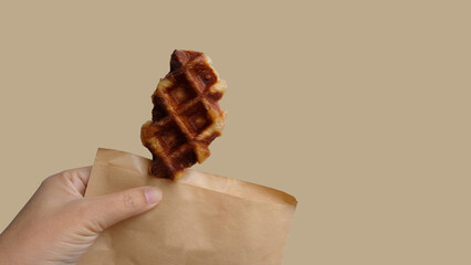 Women handing biscuit Sweet waffles on white background
