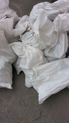 white plastic bags with garbage close-up
