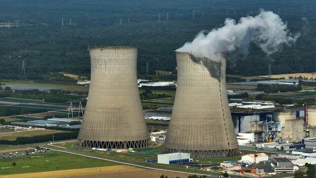 Aerial view to nuclear power plant in France. Atomic power stations are very important sources of electricity with low carbon footprint. Aerial view to big source of emissions in European Union