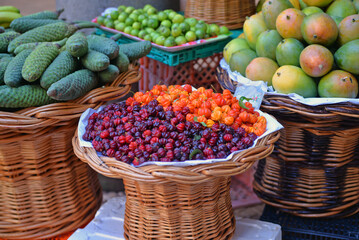 Market with fruits and vegetables in baskets. Lots of colorful fruits at the bazaar. Selling and trading. 