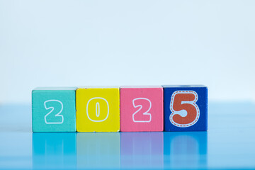 New year concept. Colorful wooden blocks displaying the year of 2025 isolated on white background...