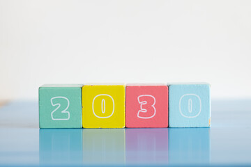 New year concept. Colorful wooden blocks displaying the year of 2023 isolated on white background...