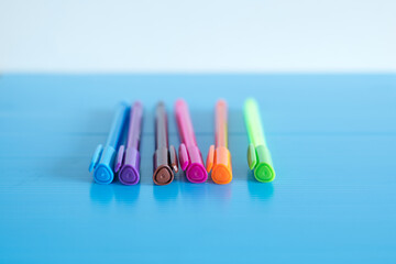 Selective focus shot of colorful felt pens in a row