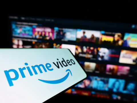 Stuttgart, Germany - 07-16-2022: Smartphone with logo of American streaming service Amazon Prime Video on screen in front of website. Focus on center-left of phone display.