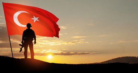 Silhouette of soldier with Turkey flag on background of sunset. Concept of crisis of war and political conflicts between nations. Greeting card for Turkish Armed Forces Day, Victory Day.
