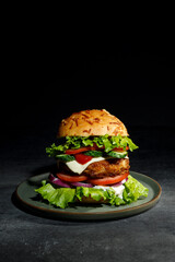 The burger is juicy and delicious on the table