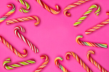 Multicolored sweets, lollipops, candies, sugar-candy wallpaper background, pattern. Bright backdrop for design. Noisy surface texture