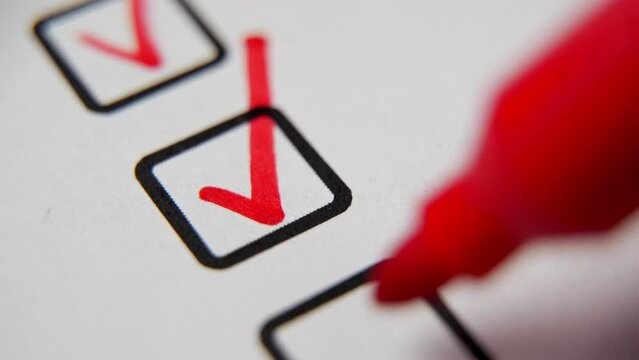 Check the box in the checklist with a red marker. Completed and completed task, obligation, obligation or responsibility