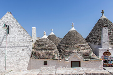 Fototapeta na wymiar The trulli, typical limestone houses of Alberobello in southern Puglia, Italy, are extraordinary examples of dry stone slab construction, a technique dating back to prehistoric times and still used