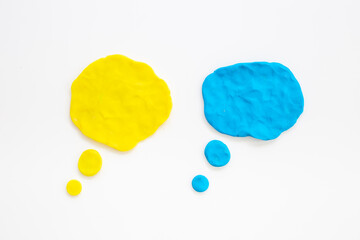 Commenication and messengers concept with text speech bubbles made of plasticine.