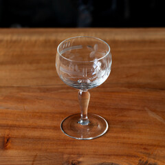 antique transparent glass set of wine glasses in luxury interior. crystal glass with engraving. glass 