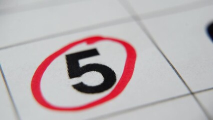The calendar 5th day of the month is circled. A red marker circles the fifth day of the month from the paper calendar. A very important date in the calendar