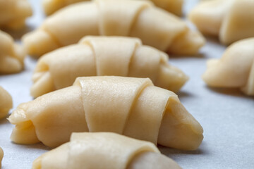 A close-up of raw croissants before baking in the oven