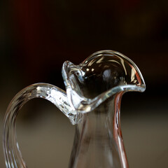 glass antique decanter in luxury interior. crystal clear wine decanter. bohemian glass closeup