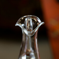 glass antique decanter in luxury interior. crystal clear wine decanter. bohemian glass closeup