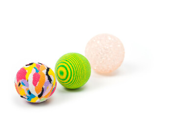 Several plastic and rubber balls for playing with pets.
