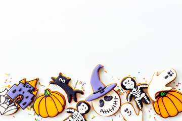 Funny halloween cookies and sweets flat lay, top view