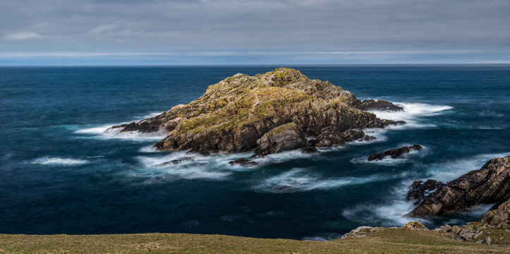 The small island of Garbh-eilean near Strathy Point on the north coast of Scotland