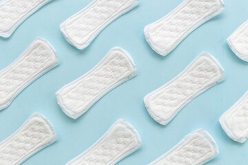 Female hygiene concept. White panty liners pattern, top view