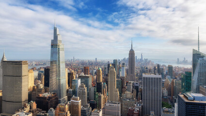 New York City skyline at sunset, roof top Manhattan urban skyscrapers. New York, USA. Panoramic...