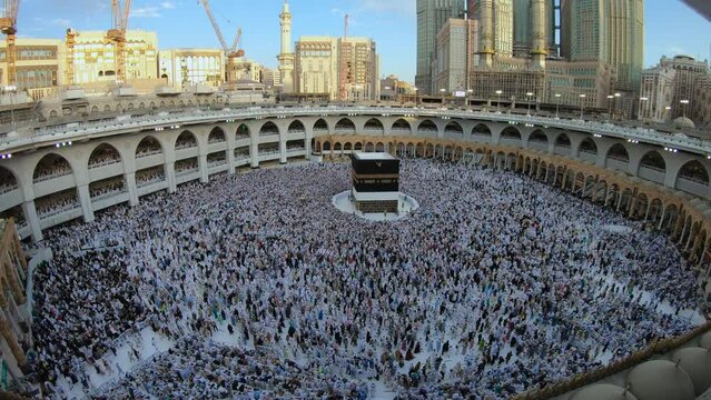 Muslim pilgrims circling around the holy Kaaba at night during Hajj 