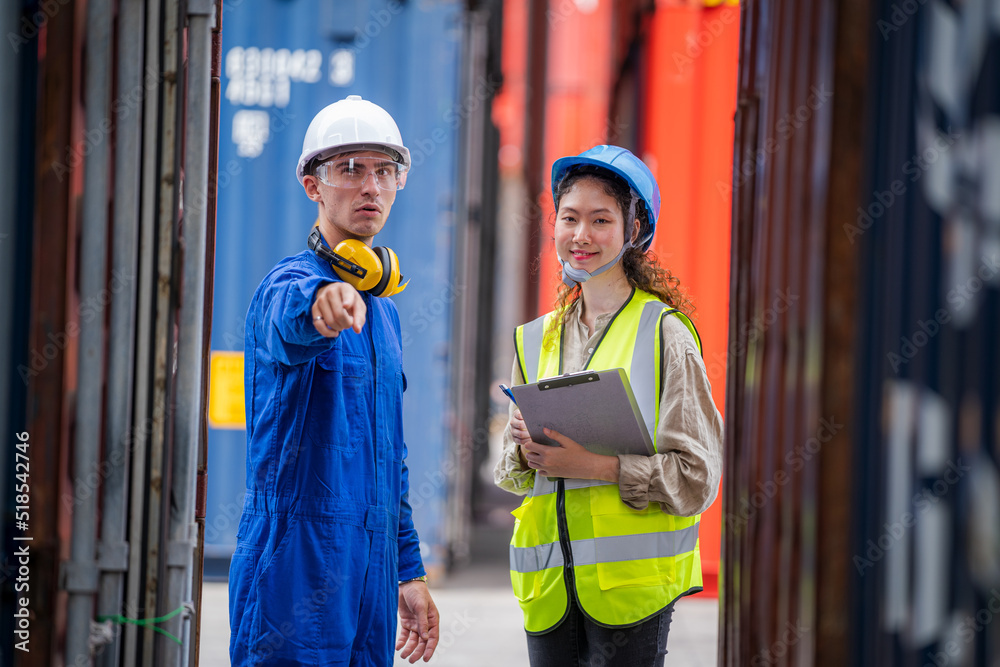Poster Technician and worker checking stock into container for loading for import Or export in the container yard,Import export shipping concept.
