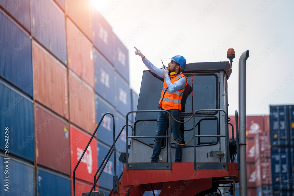 Poster container yard worker checking container at container yard warehouse,logistics transportation and sh