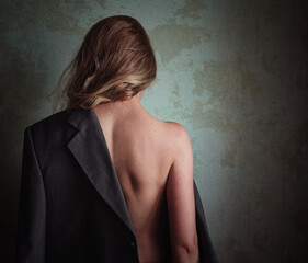 naked girl with a jacket on one shoulder